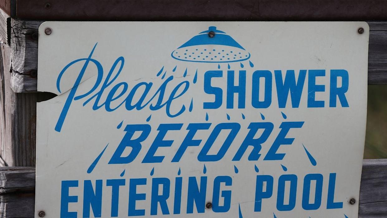 Please Shower Before Entering Pool sign