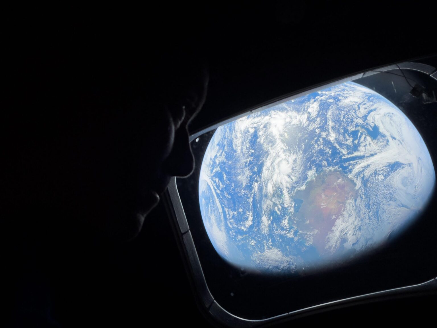 Artemis II crew snaps a pic of a land girt by sea...