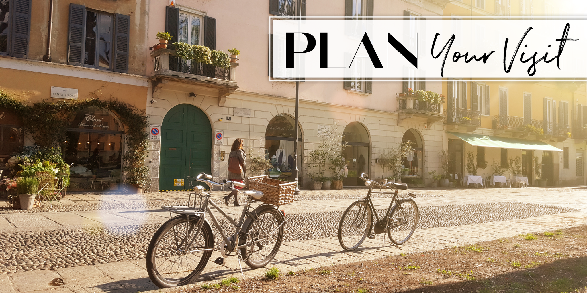 Street scene featuring bicycles and storefronts.