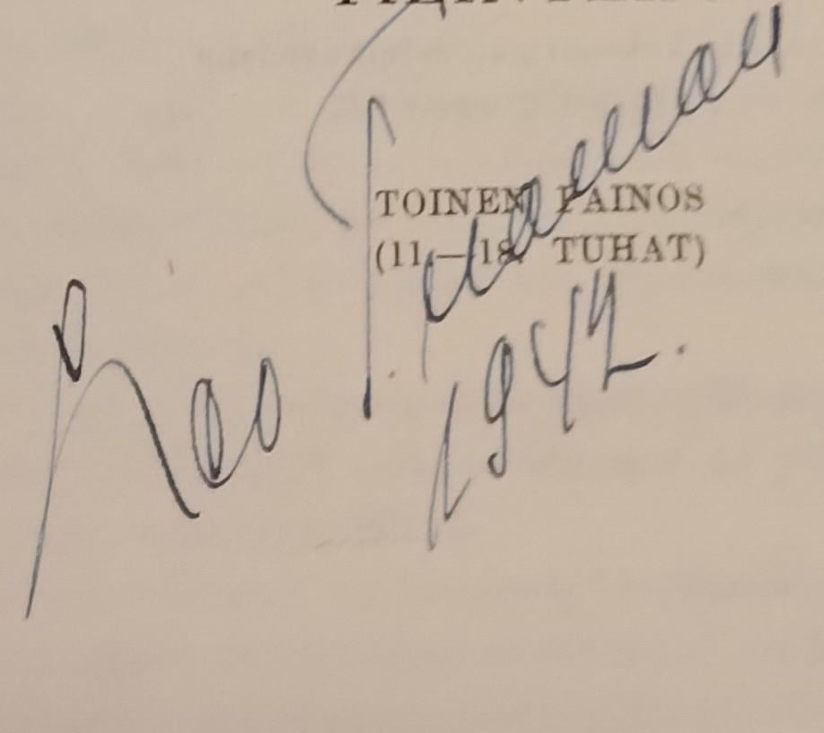 What is the name written on the book page?
