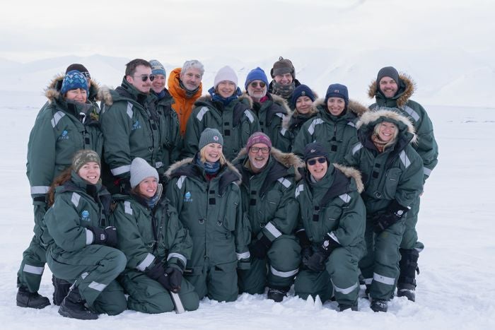 Norway's research minister Sigrun Gjerløw Aasland (front row, centre) poses with climate scientists in Svalbard
