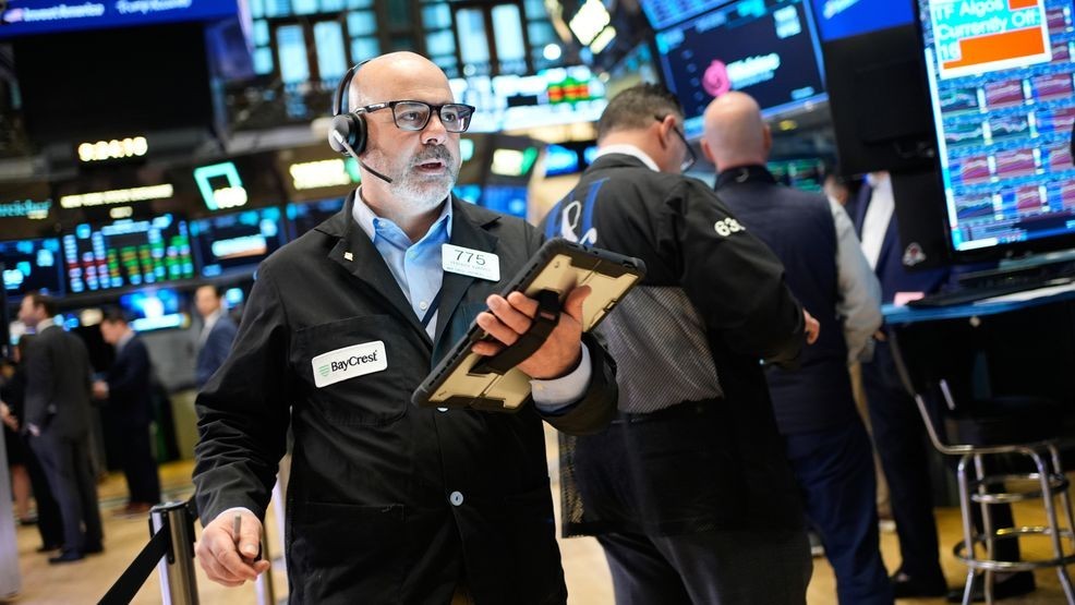 Federico DeMarco works on the floor at the New York Stock Exchange in New York, Wednesday, March 25, 2026. (AP Photo/Seth Wenig)