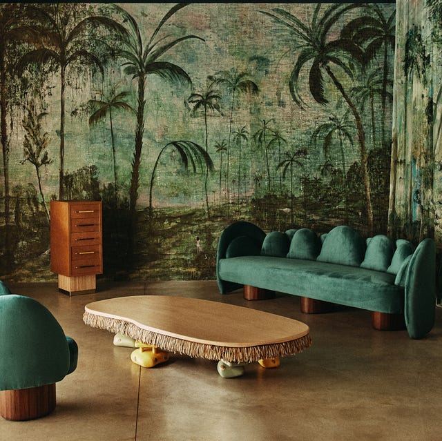 Interior room with green-toned wallpaper and modern furniture.