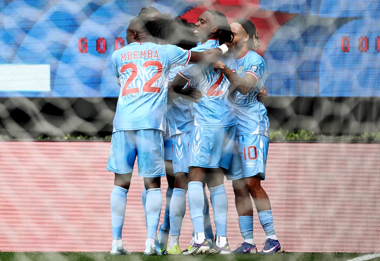 DR Congo's defender #04 Axel Tuanzebe (unseen) celebrates with teammates after scoring a goal in extra time during the 2026 FIFA World Cup qualifiers final playoff football match between the Democratic Republic of the Congo and Jamaica at the Akron Stadium in Zapopan, Jalisco state, Mexico, on March 31, 2026. (Photo by Ulises Ruiz / AFP via Getty Images)