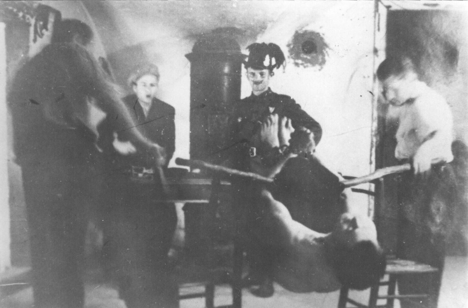Hungarian fascists during the torture of an insurgent in the Old Town in Čakovec