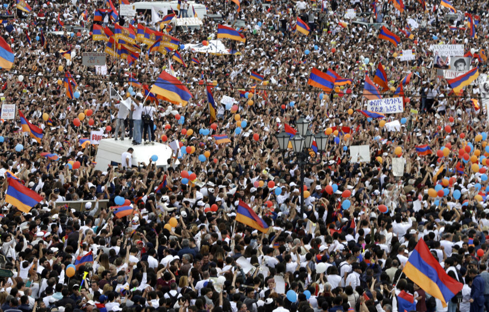 People cheer in Republic Square in Yerevan, Armenia on May 8, 2018 after Nikol Pashinian was elected the country’s prime minister