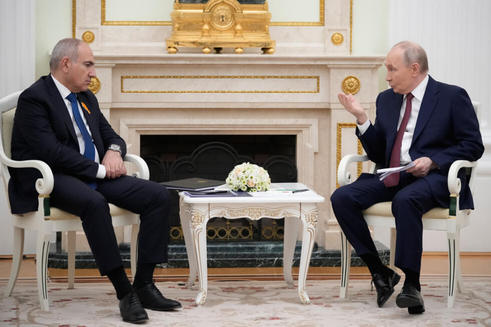Russian President Vladimir Putin, right, and Armenian Prime Minister Nikol Pashinyan talk during their meeting at the Kremlin in Moscow on April 1, 2026