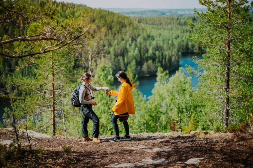 Finland considers introducing a tourist tax two hikers at Finland's Etelä-Konnevesi National Park