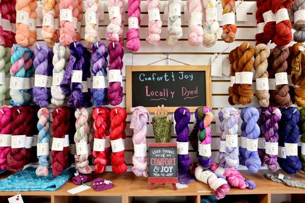 Yarn hangs on the wall for sale at Purls of Joy in Healdsburg Thursday, April 16, 2026. (Beth Schlanker / The Press Democrat)