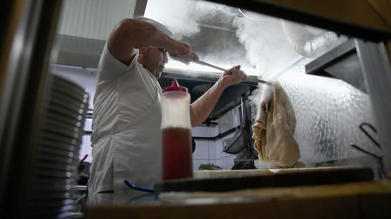 A man cooks traditional tripe soup, known as "iskembe" in Turkish and "patsas" in Greek, in a restaurant in Istanbul, Turkey.