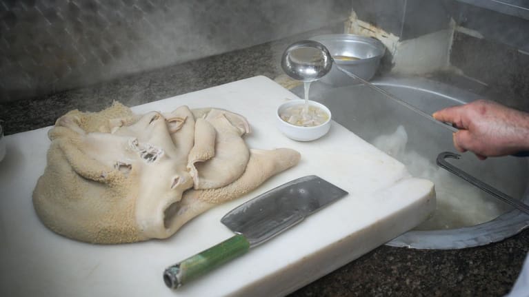A man cooks traditional tripe soup, known as "iskembe" in Turkish and "patsas" in Greek, in a restaurant in Istanbul, Turkey.