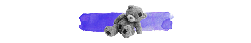 black and white teddy bear on top of a wash of purple colour
