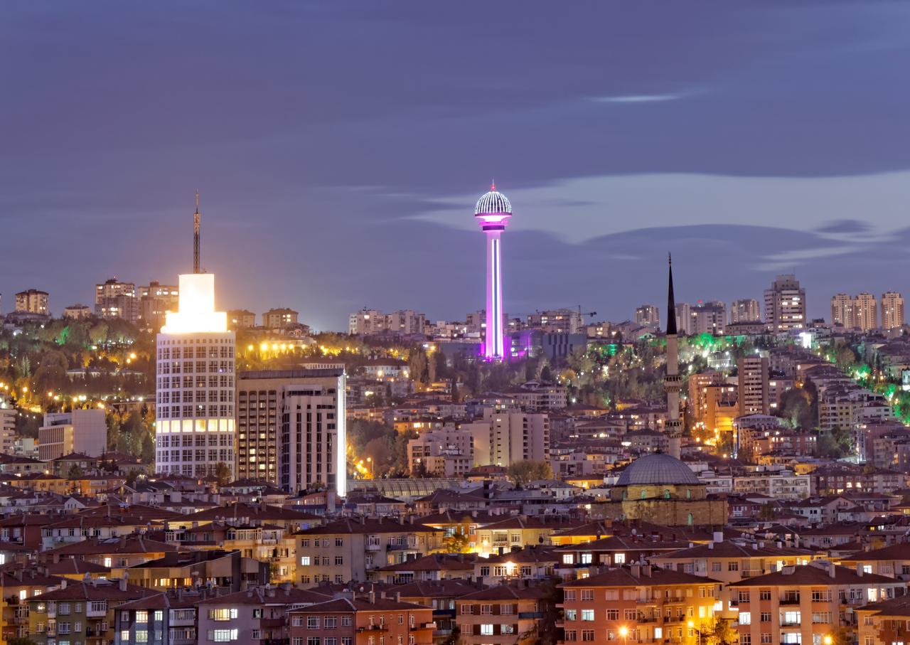 Modern glass skyscrapers reflect the clear blue sky in the Levent business district of Istanbul, Turkiye. (Adobe Stock Photo)