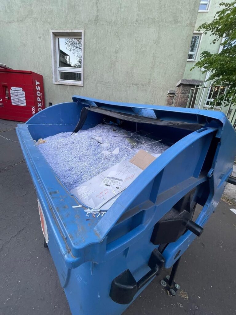 Trash can full of shredded documents behind the Hungarian state media’s building after the election