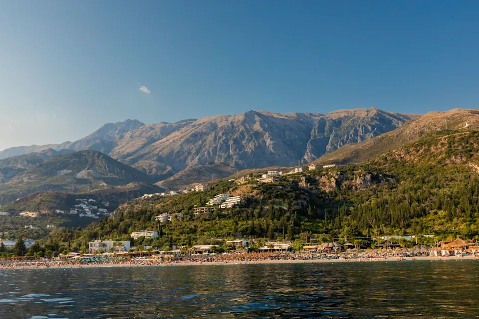 View of dhermi coast with mountains and beach in albania from the water
