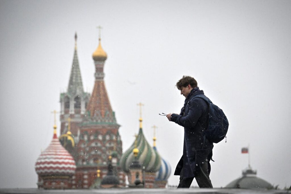 A man walks in front of St. Basil