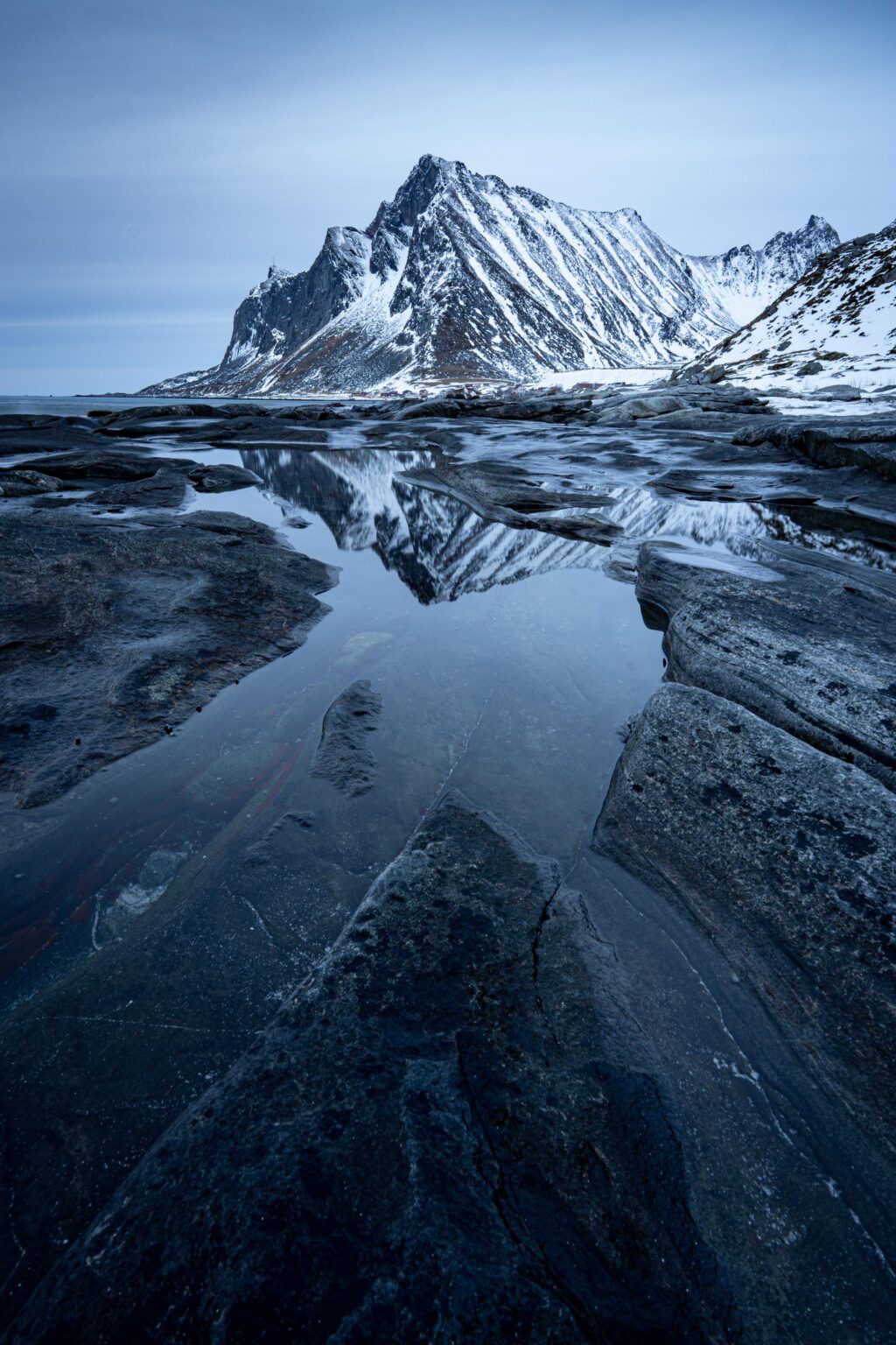 Rock pools near Vareid. Lofoten, Norway. [OC][2667x4000]