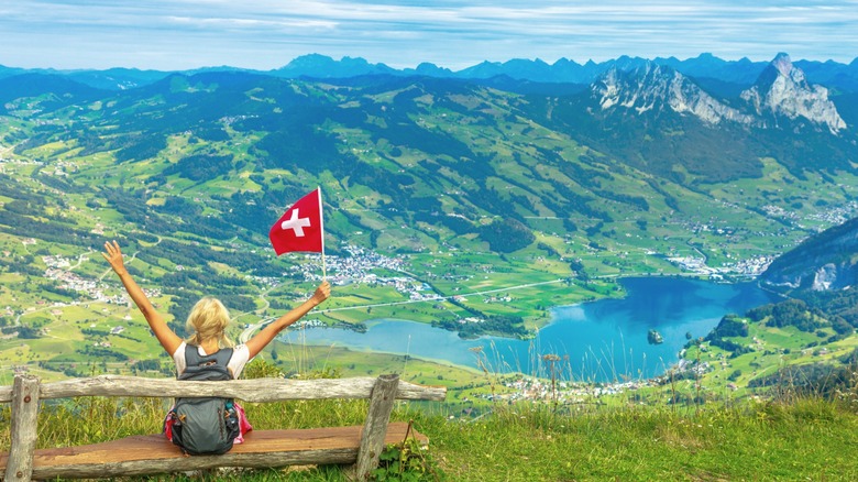 a hiker enjoys the views from Rigi Scheidegg to Krabel in Switzerland