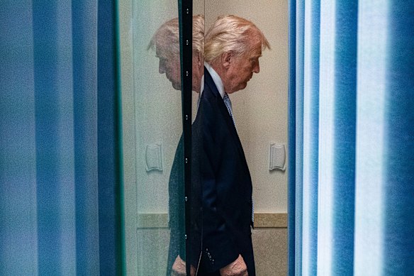 Donald Trump leaves the press briefing room at the White House on Monday.