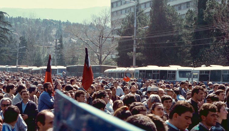 Protestors in a street in the 1990s.