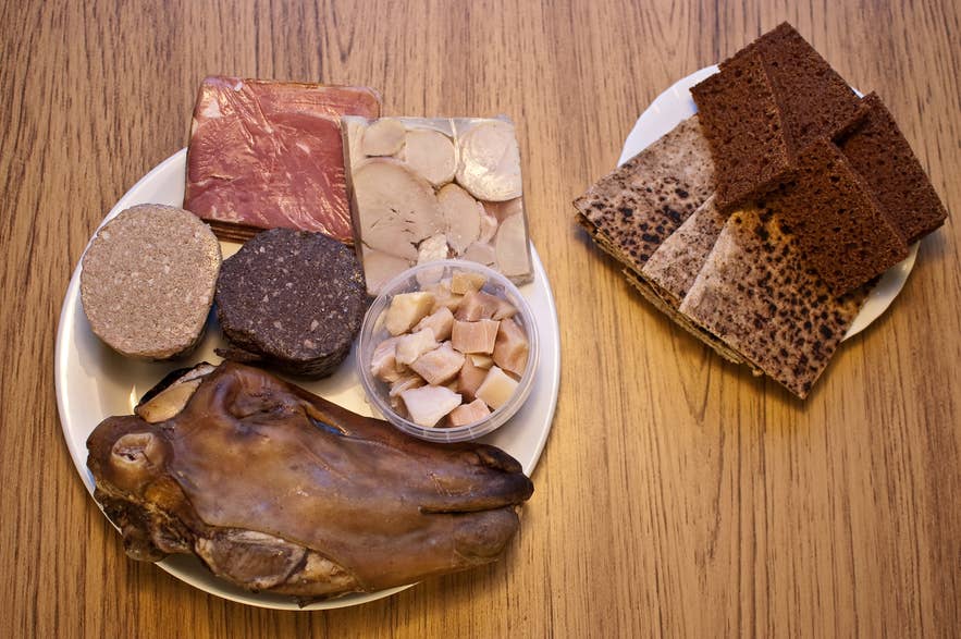 Traditional Icelandic food platter with lamb head, fermented shark, and rye bread, among others. Traditional Icelandic food platter with lamb head, fermented shark, and rye bread, among others.