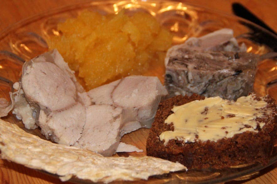 Hrutspunkar or pickled ram testicles on a plate with other traditional Icelandic foods. Hrutspunkar or pickled ram testicles on a plate with other traditional Icelandic foods.