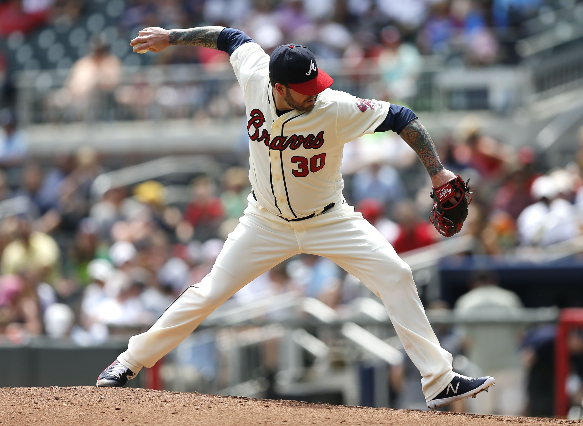 ATLANTA, GA - MAY 20: Pitcher Peter Moylan #30 of the Atlanta Braves throws a pitch during the game against the Miami Marlins at SunTrust Park on May 20, 2018 in Atlanta, Georgia. (Photo by Mike Zarrilli/Getty Images)