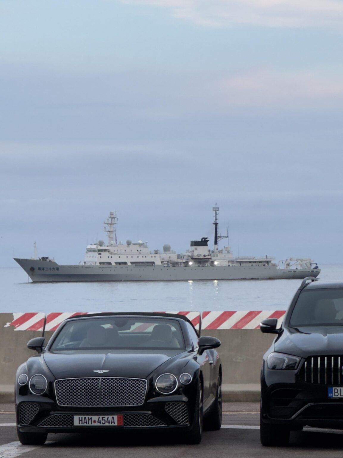 Does anyone know anything about the warship docked in Port Hercule?