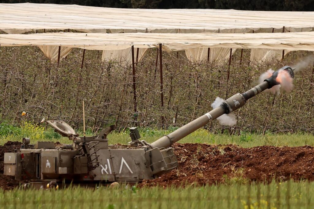 An Israeli self-propelled howitzer artillery gun fires rounds towards southern Lebanon from a position in the Upper Galilee in northern Israel near the border, April 15, 2026. (AFP Photo)