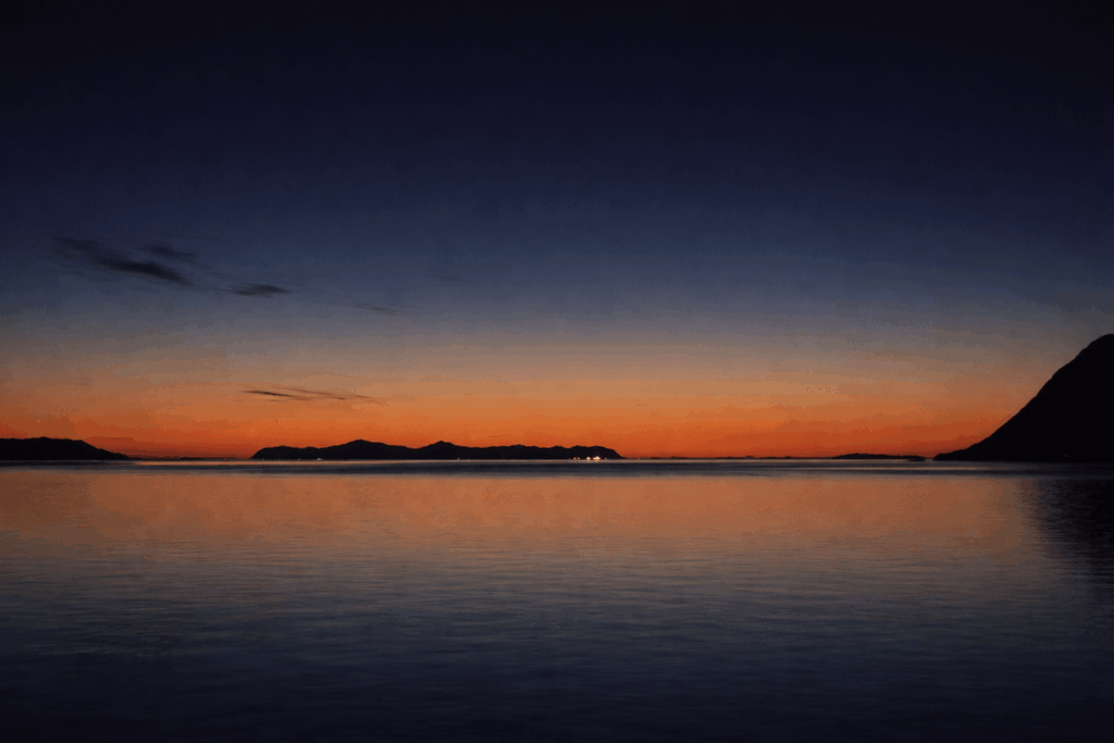 Midnight. The photo was taken from Nupen on Hinnøya, facing Andøya in the center of the image.