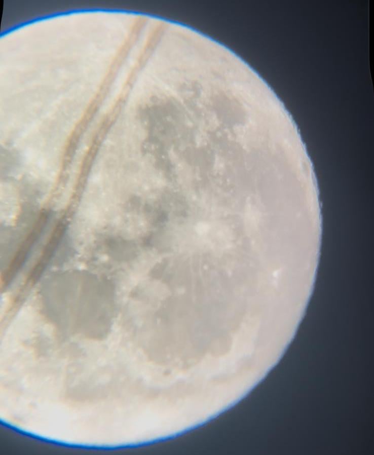 Flower Moon with contrail seen tonight in Belgium