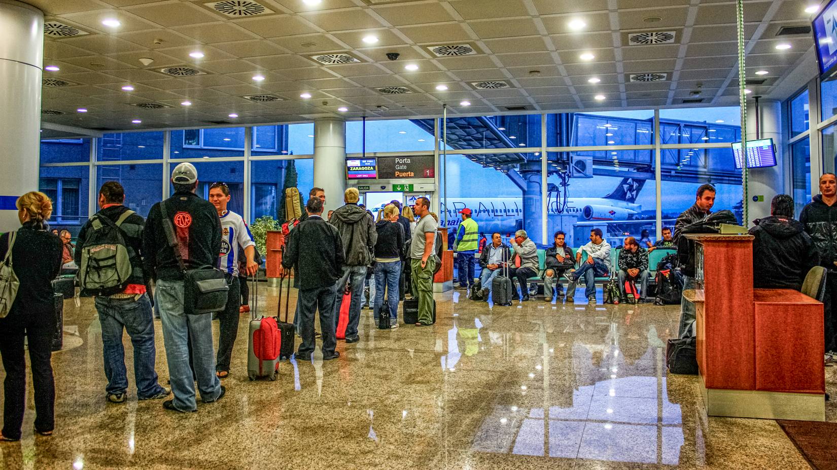 Passengers waiting to board at an airport during summer season in Barcelona