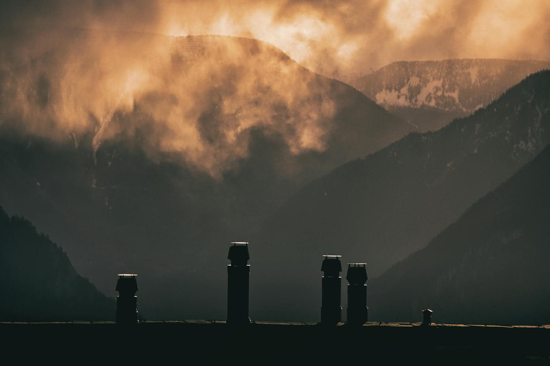 silhouette of mountains during sunset