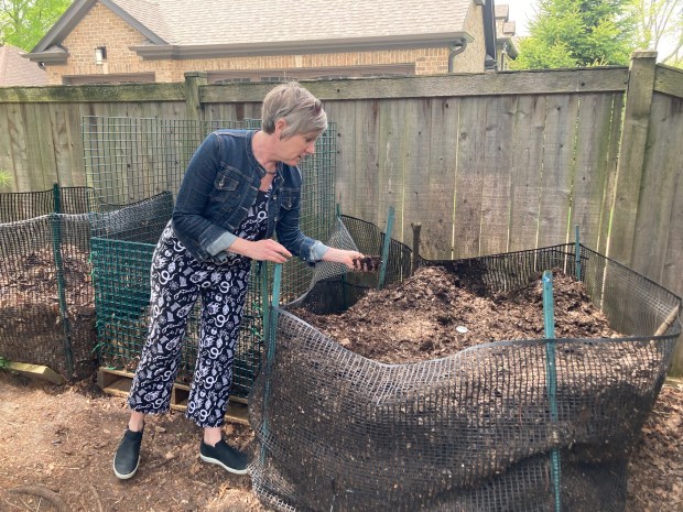 Amy Bartucci of Park Ridge maintains a compost pile in her yard. Bartucci, of Go Green Park Ridge, will one of several hosts of a Sustainable Yard Walk July 14 with the Park Ridge Sustainability Commission. (Pam DeFiglio, Chicago Tribune/Pioneer Press)