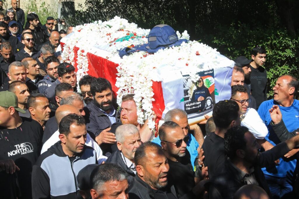Mourners carry the coffin of Lebanese journalist Amal Khalil during her funeral procession in Bissariye town, south of Sidon, Lebanon on April 23, 2026. (AFP Photo)