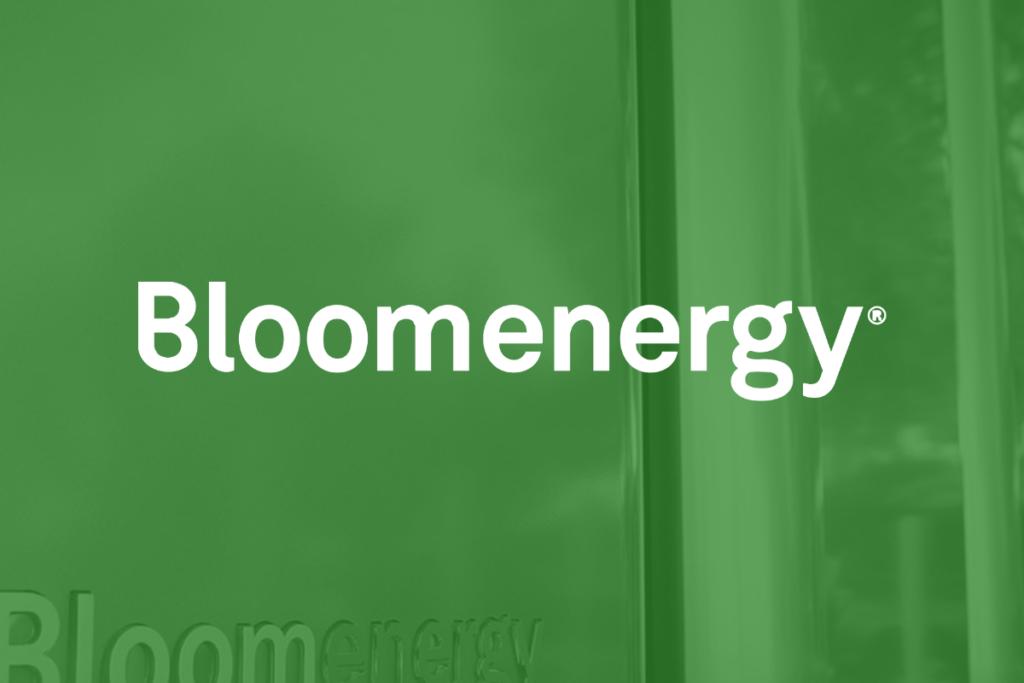White Bloom Energy logo set over green picture of Bloom fuel cell housing.