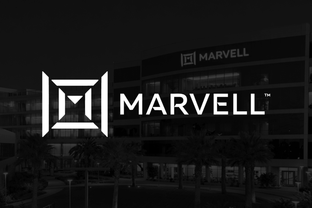 Prediction: 1 Artificial Intelligence (AI) Stock Will Quietly Double While the Market Panics Over TurboQuant Marvell Technology logo in front of black backdrop with buildings in background.