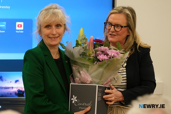 Cllr Geraldine Kearns, Deputy Chairperson, Newry, Mourne and Down District Council presents a bouquet to Estonian Ambassador to Ireland,  Kairi Kunka at the Reel to Revolution film launch at Gaeláras Mhic Ardghail in Newry. Photograph: Columba O'Hare/ Newry.ie 