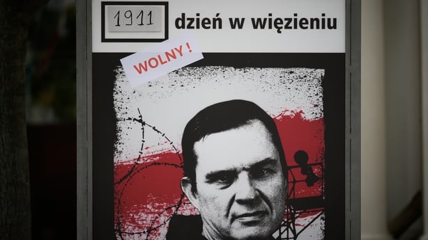 A sign counting the days journalist Andrzej Poczobut is in Belarusian captivity is seen in Warsaw, Poland on 28 April, 2026. The sign now has a sticker reading