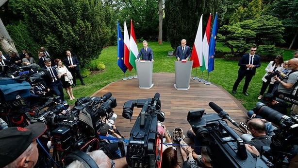 Hungary's Prime Minister Peter Magyar (L) and Poland's Prime Minister Donald Tusk give a joint press conference