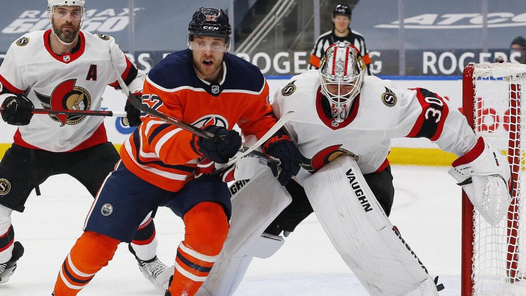 Former Oiler Patrick Russell records two goals as Denmark tries to avoid relegation Mar 10, 2021; Edmonton, Alberta, CAN; Edmonton Oilers forward Patrick Russell (52) and Ottawa Senators goaltender Matt Murray (30) look for a loose puck during the first period at Rogers Place. Mandatory Credit: Perry Nelson-Imagn Images