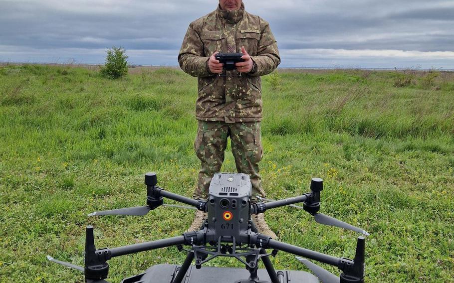 A Romanian soldier prepares to operate a drone.