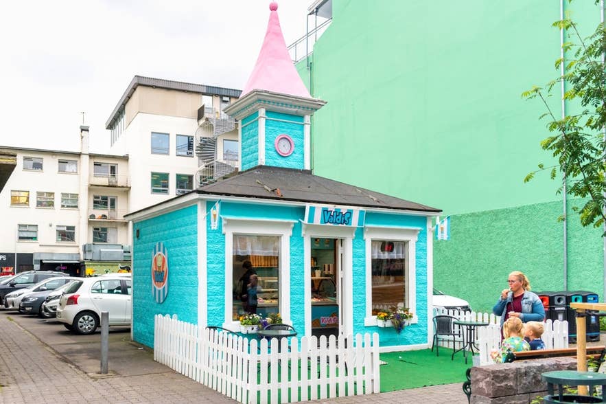 Icelander woman with children outside Valdis Ice Cream Shop in Reykjavik, Iceland. Icelander woman with children outside Valdis Ice Cream Shop in Reykjavik, Iceland.