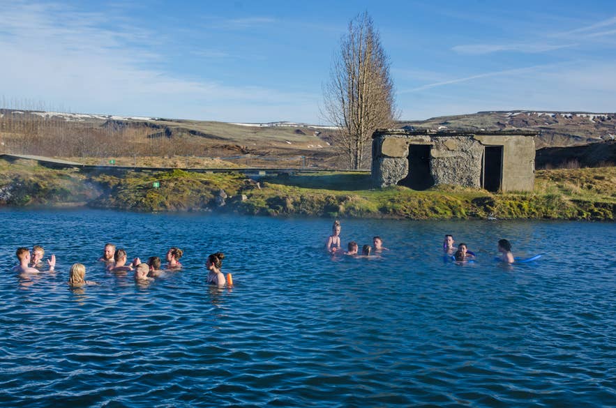 Icelanders relaxing in the Secret Lagoon Hot Spring in Fludir, one of Iceland’s oldest geothermal pools. Icelanders relaxing in the Secret Lagoon Hot Spring in Fludir, one of Iceland’s oldest geothermal pools.