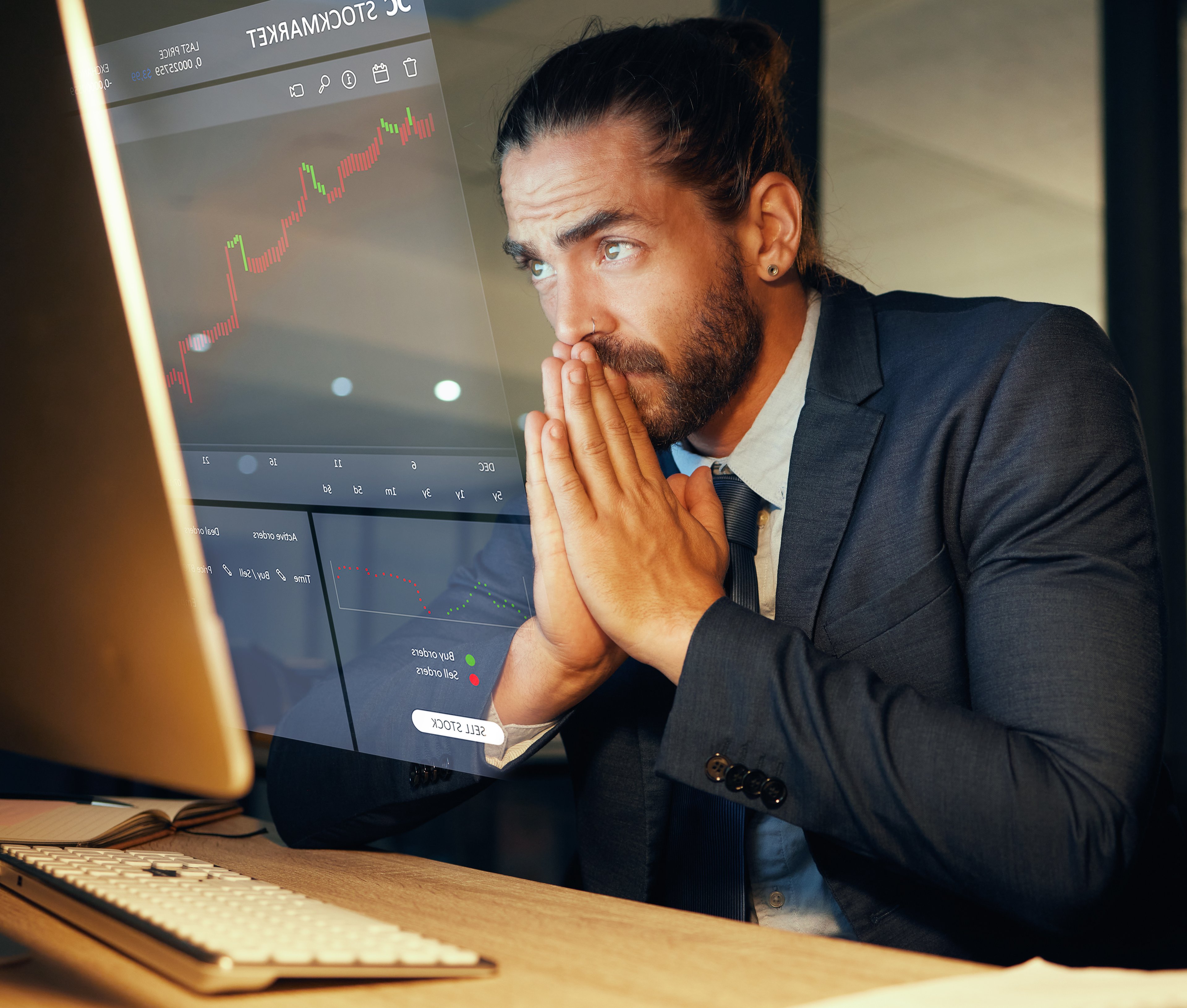 Nervous man looking at a computer screen 