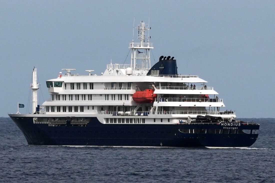 The MV Hondius cruise ship departs the port in Praia, Cape Verde, Wednesday, May 6, 2026.