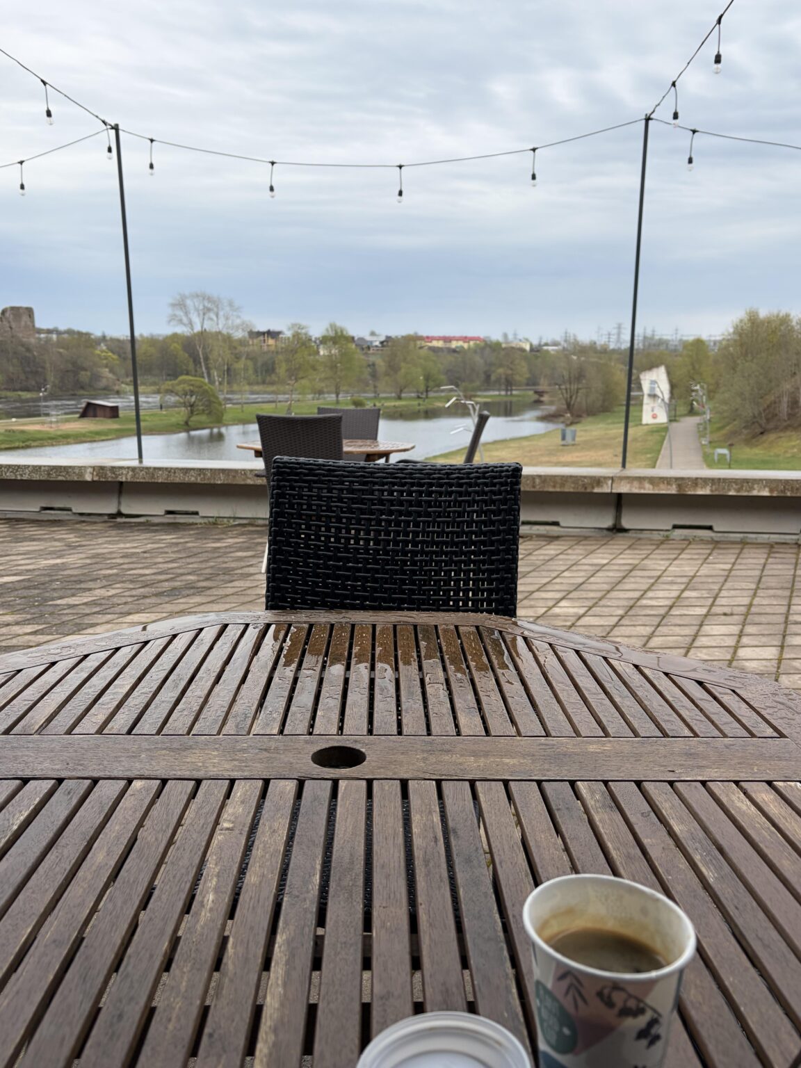 I visited Narva last week. Here I am enjoying a cup of coffee while I watch the other side of the river a North Korea light version.
