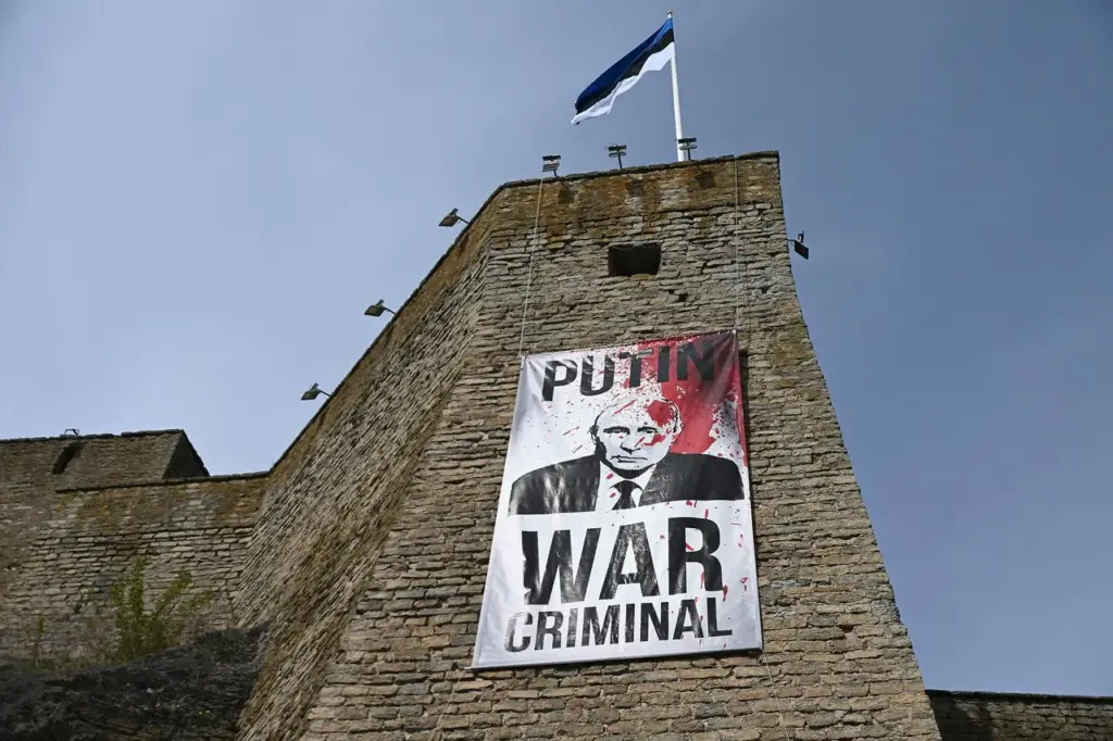 A museum in Narva, Estonia, hung a banner reading “Putin is a war criminal” for May 9 A museum in Narva, Estonia, hung a banner reading "Putin is a war criminal" for May 9