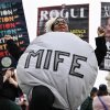 A woman dressed as a mifepristone pill is at rally outside the US Supreme Court on April 2, 2025.