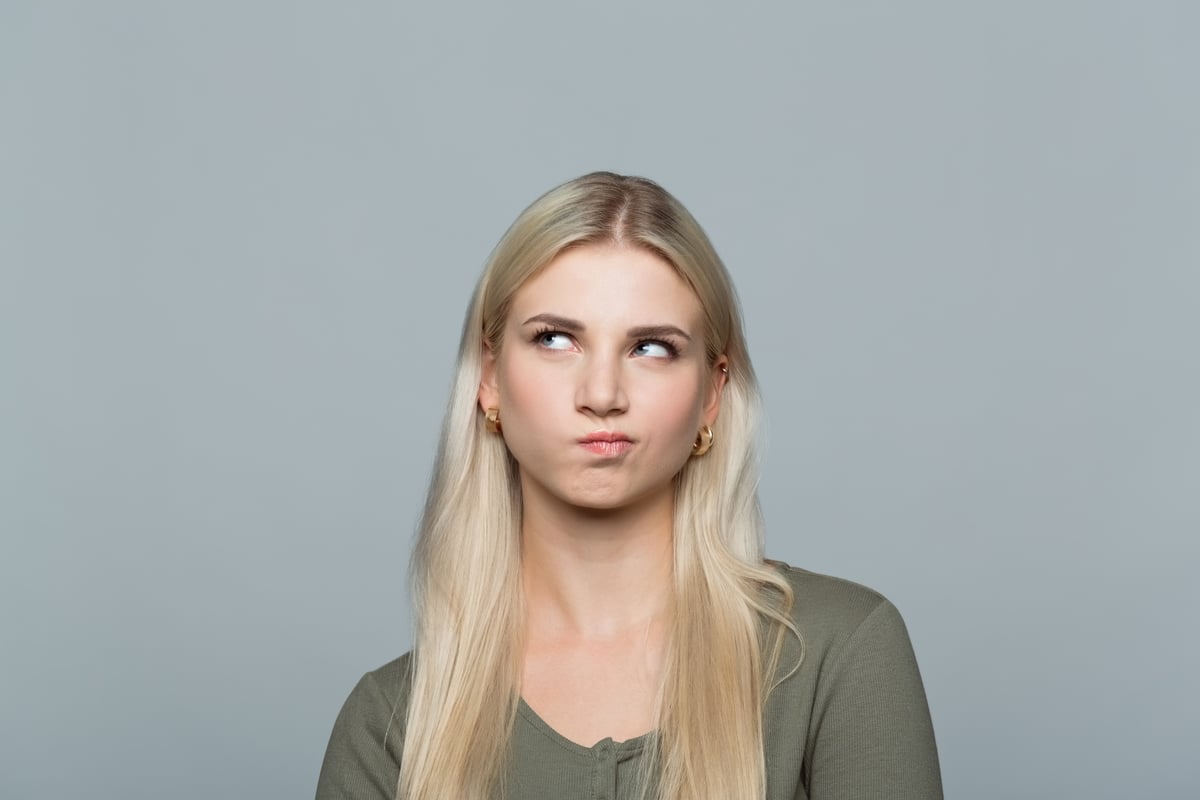 A person with a quizzical look on their face.